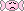 small pink piece of candy with sad facial expression